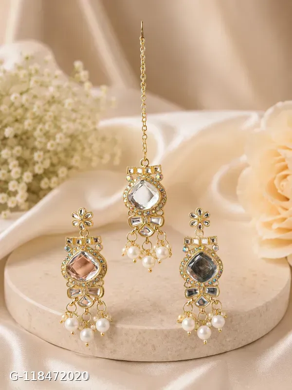 This multicolor gold-plated necklace set by Aadvik Designs features teardrop-shaped stones and matching earrings.