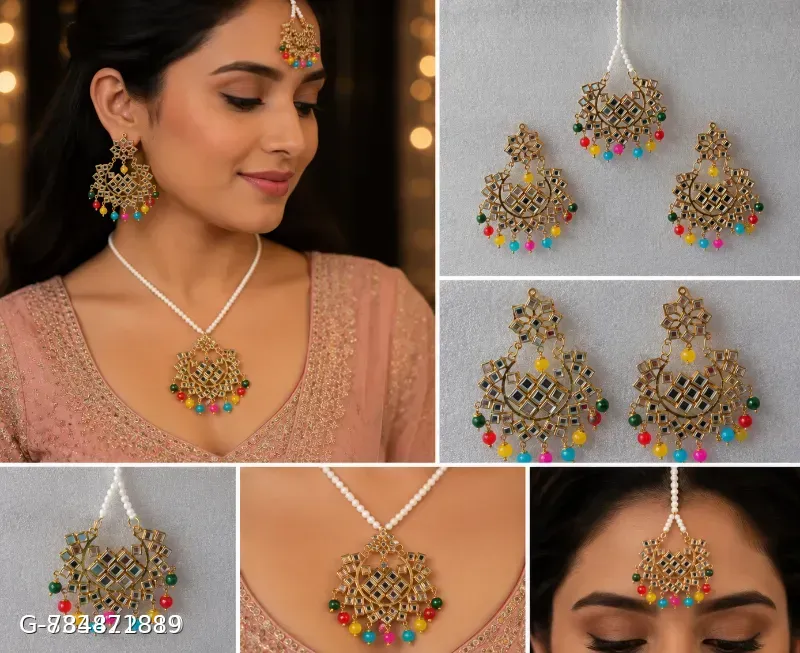 This classic multi-color Jhumka set with maang tika features gold-plated alloy construction adorned with mirror work and vibrant beaded drop