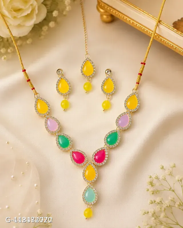 This multicolor gold-plated necklace set by Aadvik Designs features teardrop-shaped stones and matching earrings.